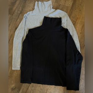 2 ribbed turtlenecks. Women’s size L and XL. Black and gray.